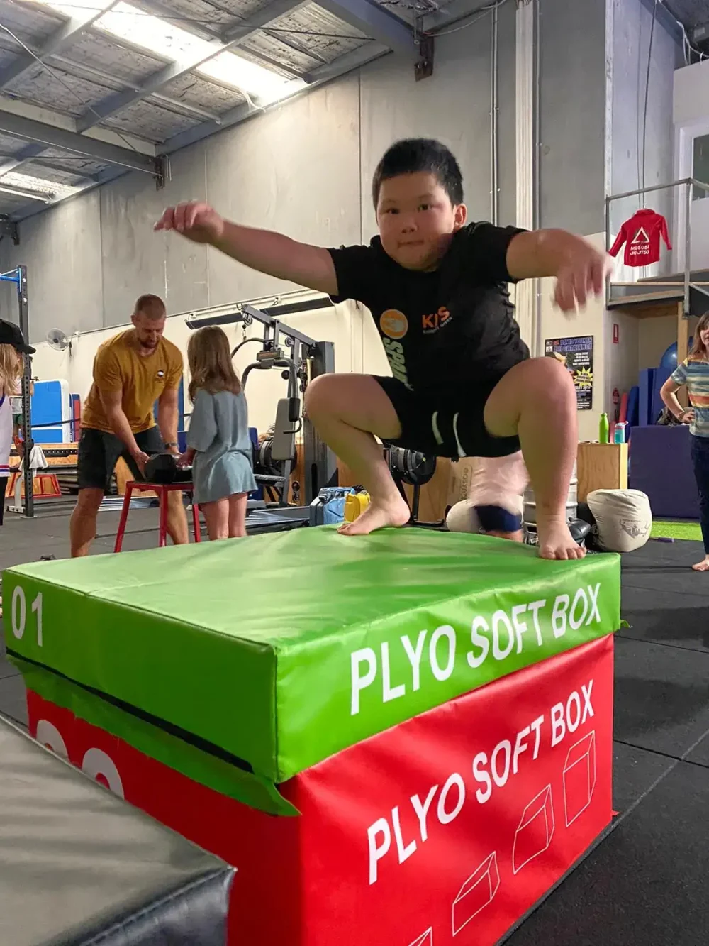 • Kids performing functional movements in a fitness session in Eltham