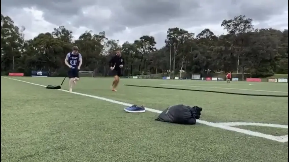 client performing a sled drag exercise during an outdoor personal training session at functional fitness eltham