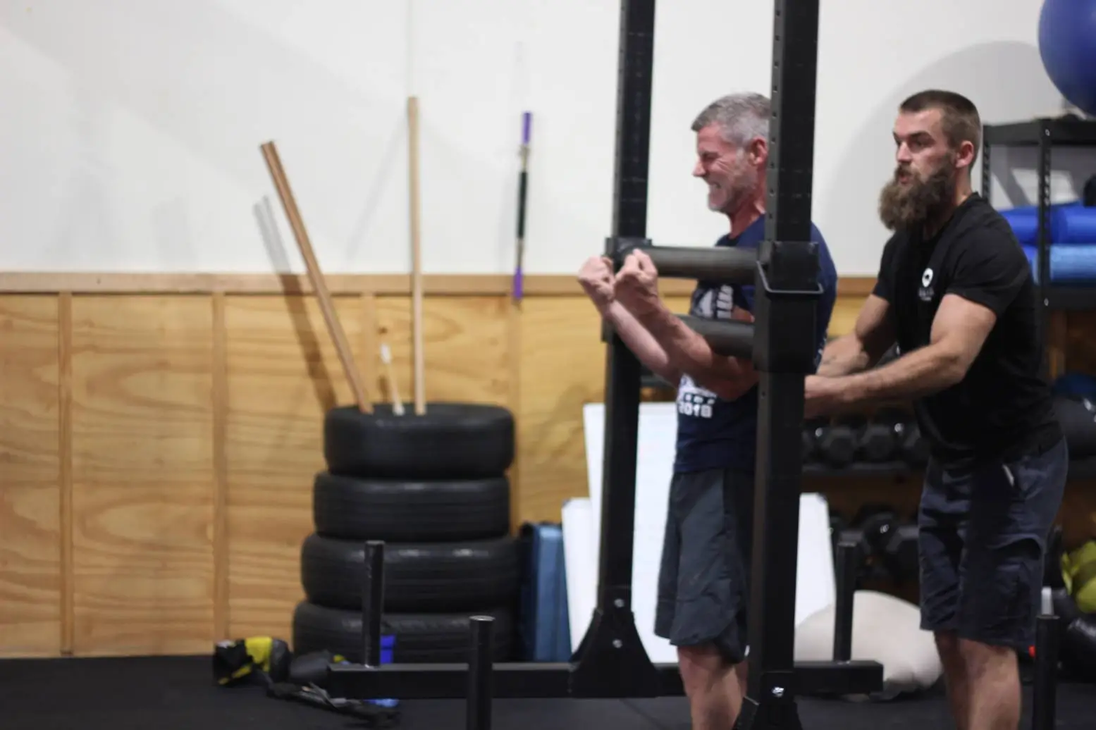 participant holding a yoke during a strength training session at functional fitness eltham